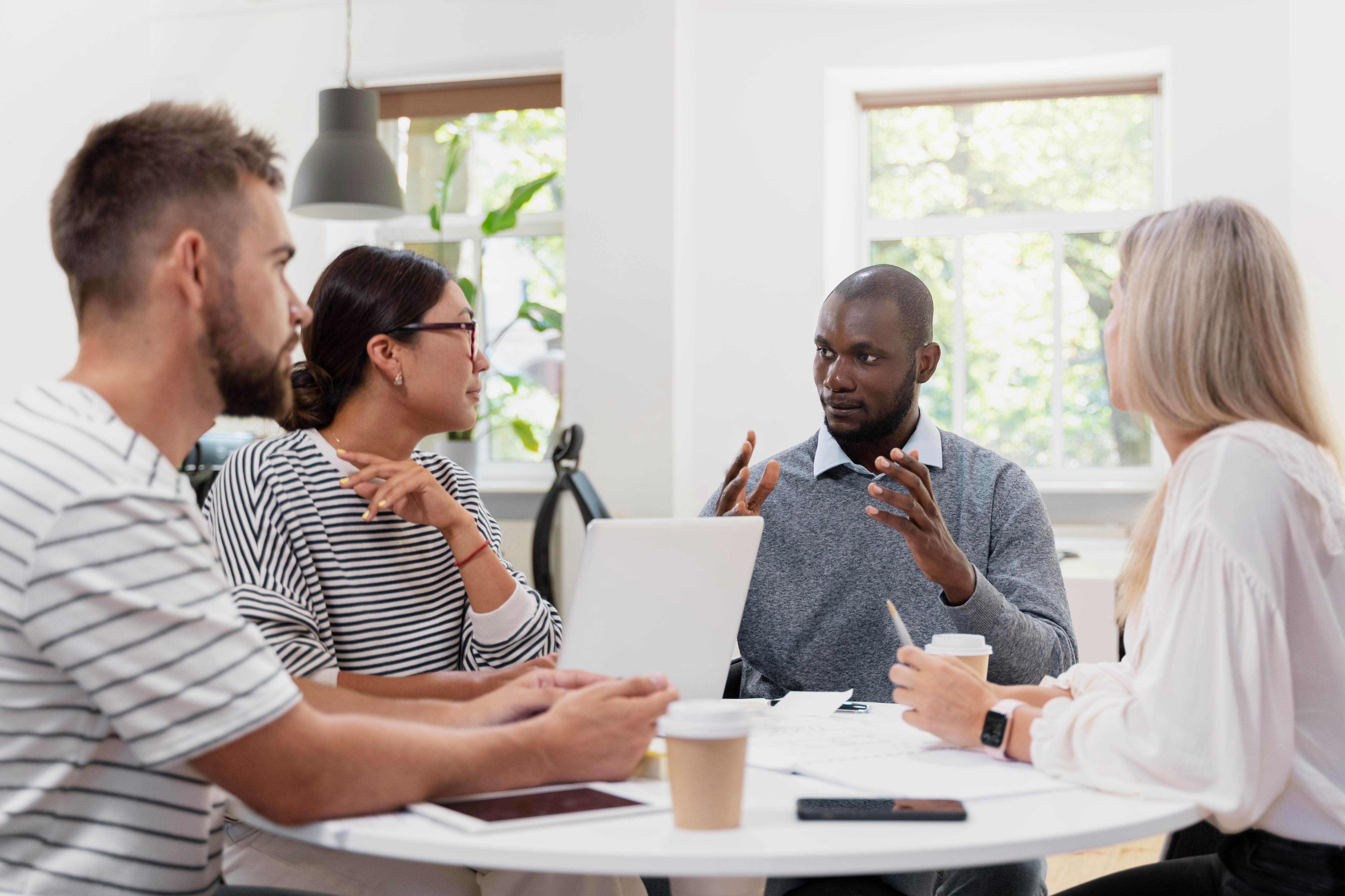 close-up-young-colleagues-having-meeting.jpg